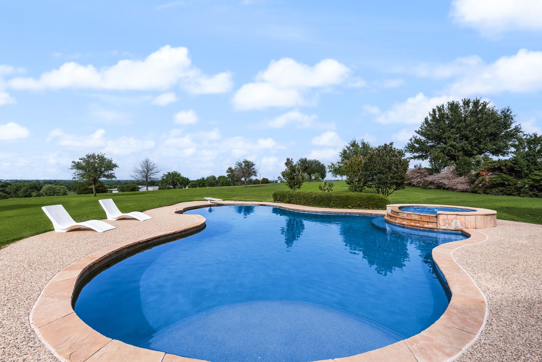 Pool and spa overlooking open pasture